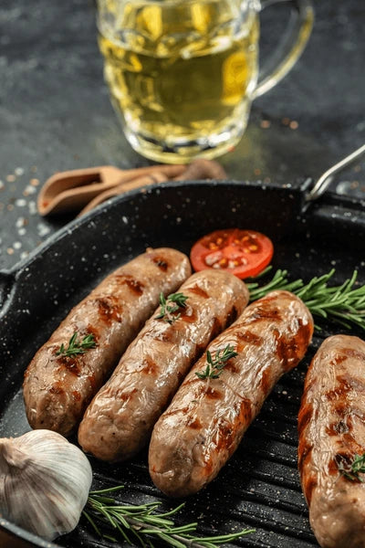 Grilled beer bratwurst sausages on a grill pan
